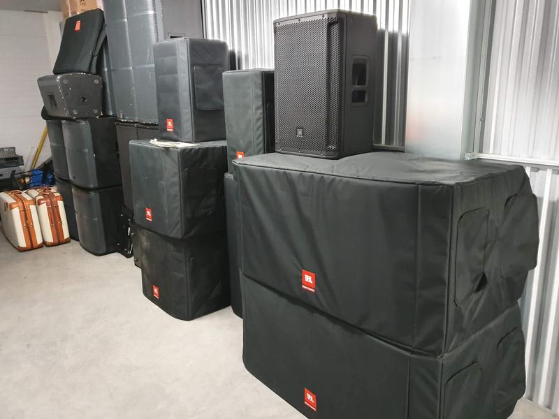 Qudos Audio JBL speakers and subwoofers in storage