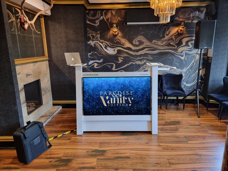 Qudos Audio DJ booth with event screen in a luxury venue